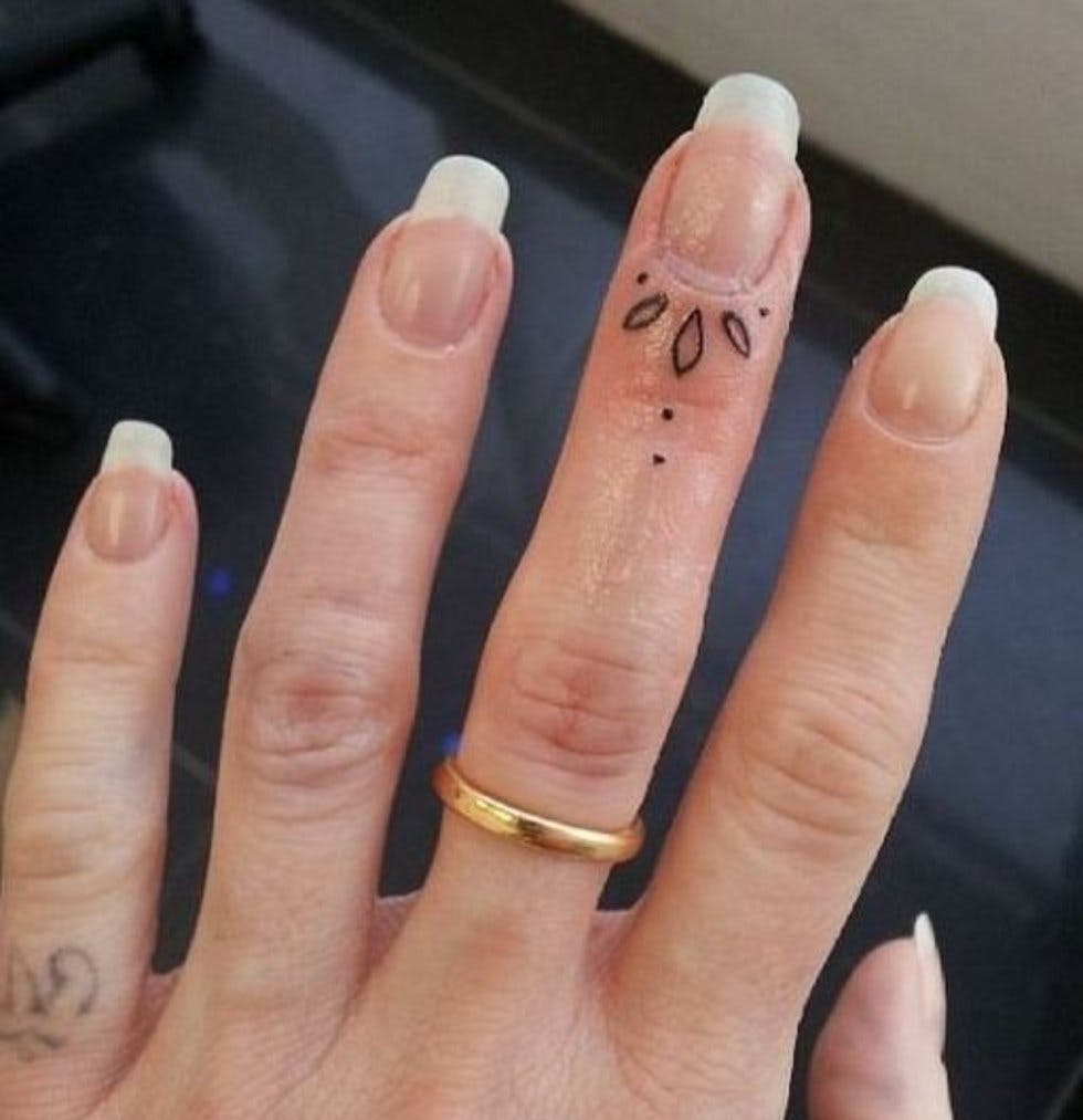 50 delicate and tiny finger tattoos to inspire your first (or next