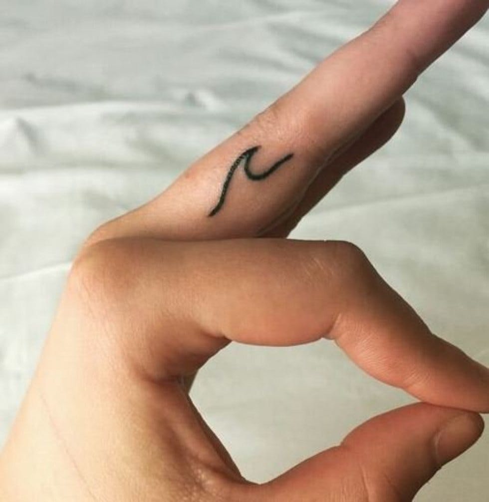 50 delicate and tiny finger tattoos to inspire your first (or next
