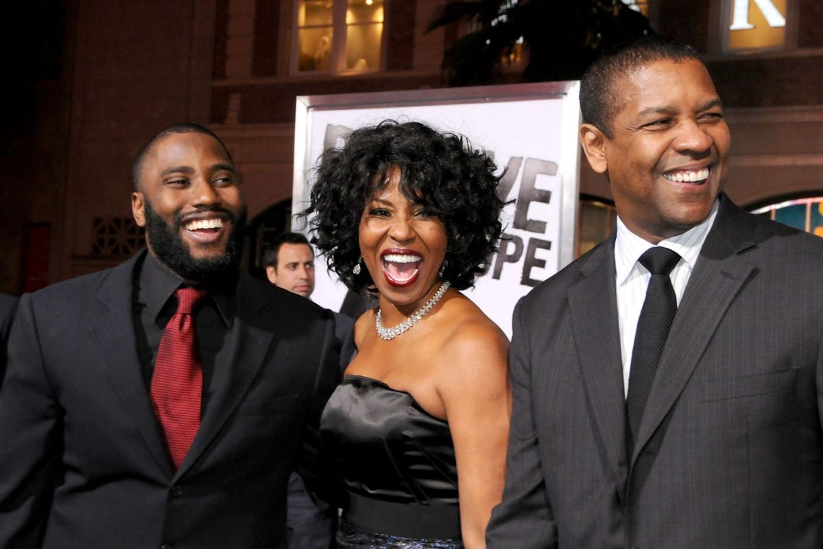People: John David Washington, Pauletta Washington, Denzel Washington at Los Angeles premiere of The Life of Eli