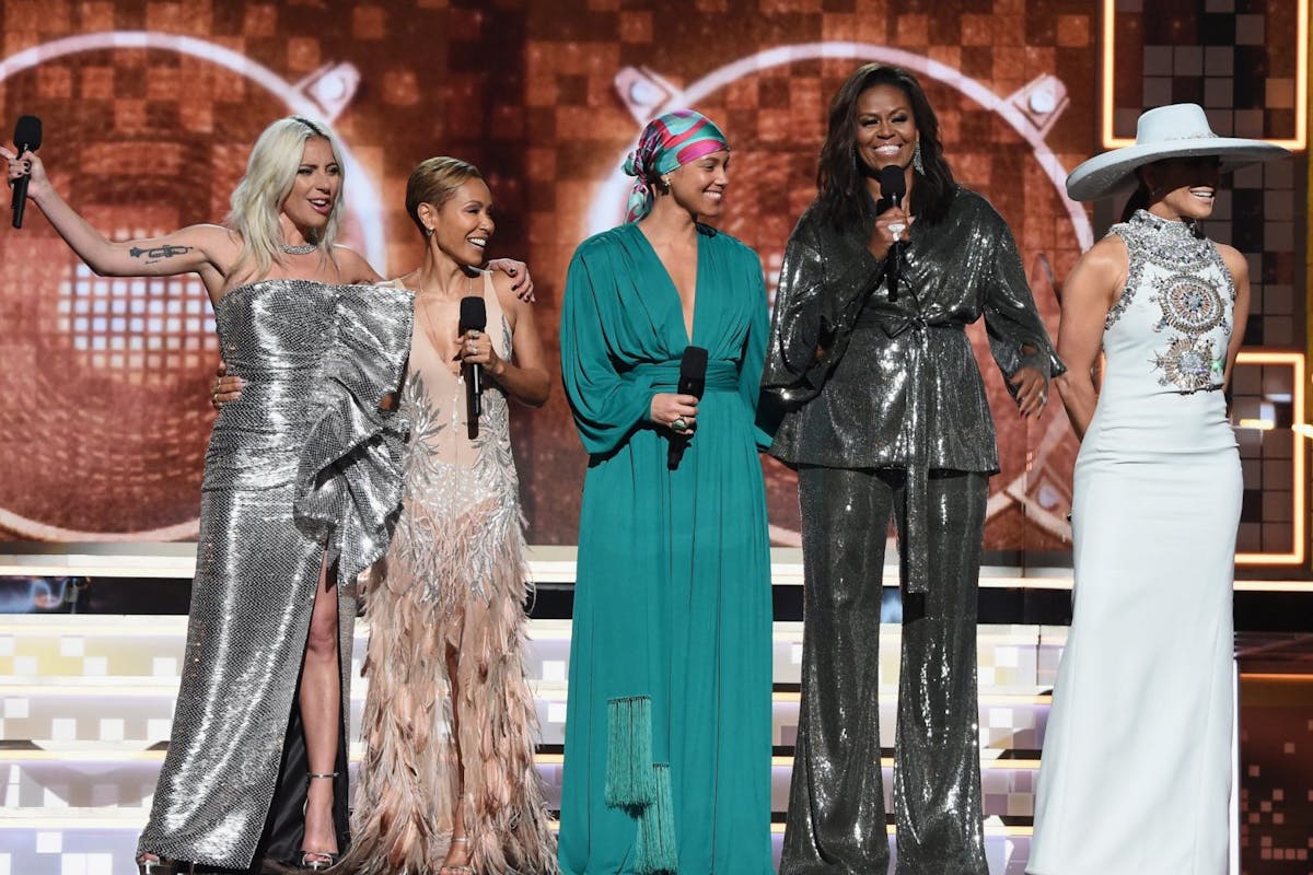 61st Annual GRAMMY Awards - Inside LOS ANGELES, CA - FEBRUARY 10: (L-R) Lady Gaga, Jada Pinkett Smith, Alicia Keys, Michelle Obama and Jennifer Lopez speak onstage during the 61st Annual GRAMMY Awards at Staples Center on February 10, 2019 in Los Angeles, California. (Photo by Kevin Mazur/Getty Images for The Recording Academy)