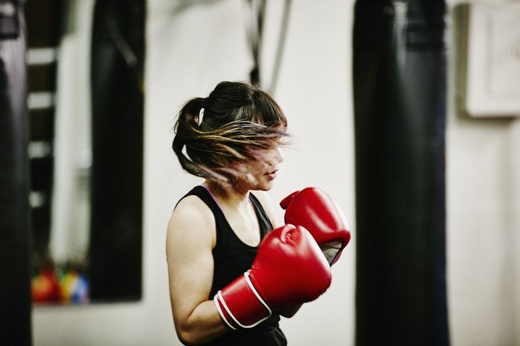A female kickboxer in training